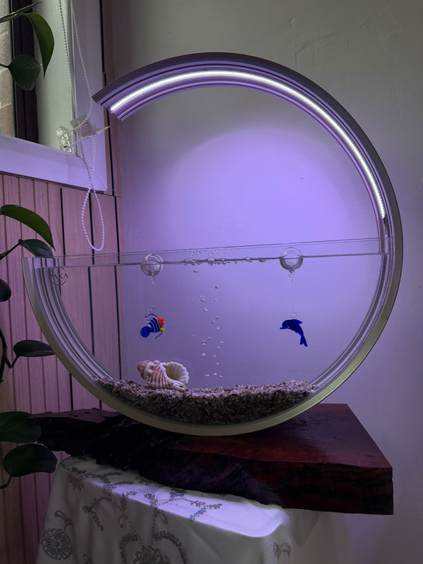 Close-up of the moon aquarium with handmade glass figures
